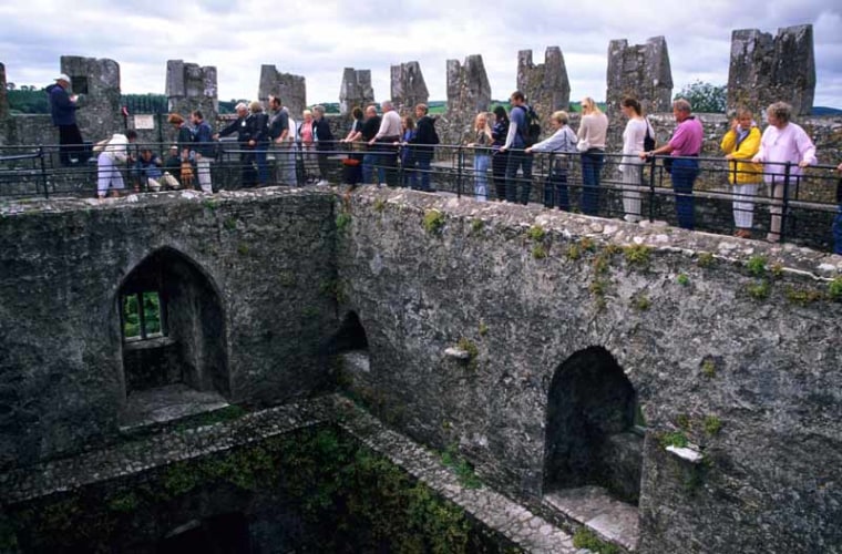 ACBAAY Queue to kiss the Blarney Stone, Blarney Castle, Co Cork, Republic of Ireland.